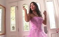 This asian tranny in awesome pink dress poses for camera.