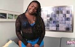 Ebony tranny Honey Bunny is playing with her big boobs.