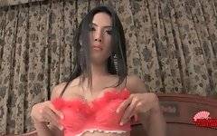 Slutty ladyboy takes her red bra off and tenders her boobs.